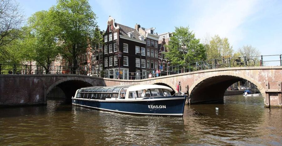 Amsterdam: 75 Minute City Canal Cruise with Audio Guide - Centraal Station, the IJ River, and modern Amsterdam