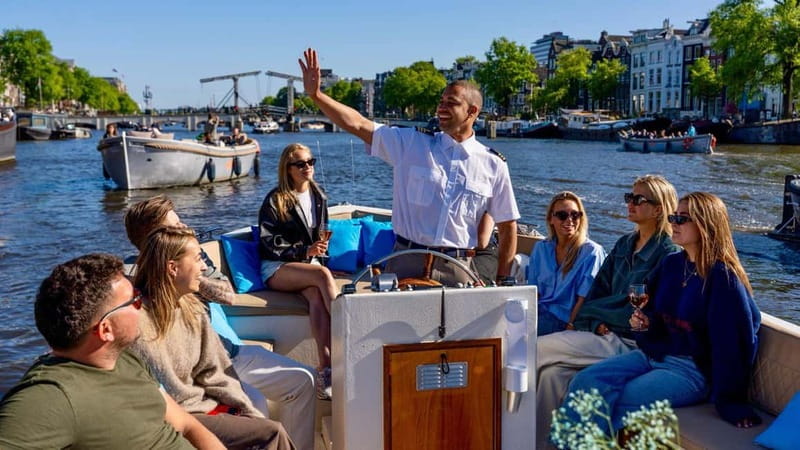 Amsterdam: Canal Cruise in Open Boat with Drink Option - Why a canal cruise is a smart first look at Amsterdam