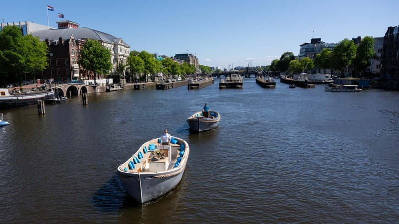 Amsterdam: Canal Cruise in Open Boat with Drink Option - Choosing between Central Station and Anne Frank House