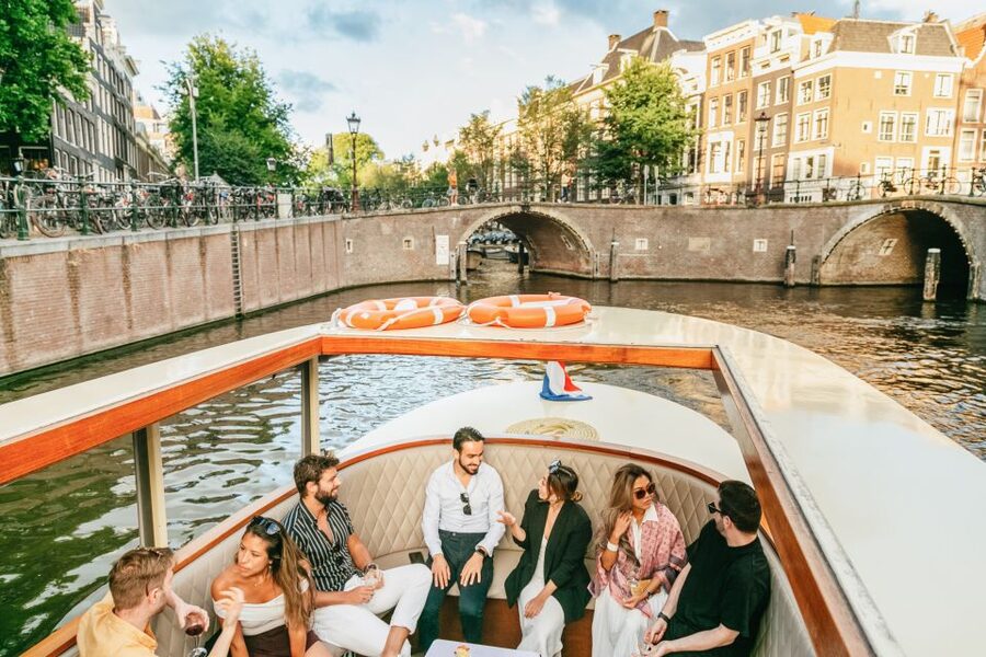 Amsterdam: Classic Saloon Boat Cruise with Cheese & Wine - Cheese, wine, and the social side of the cruise