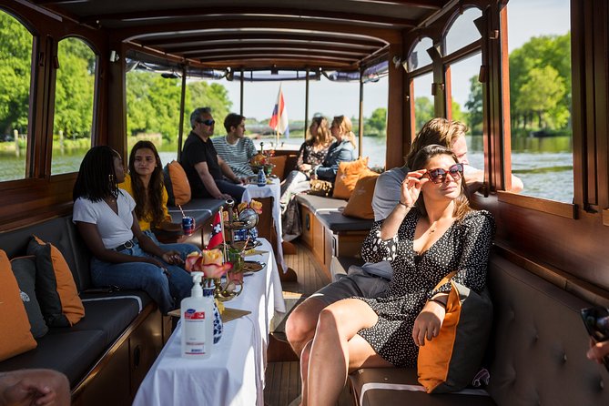 Amsterdam Classic Saloon Boat Cruise with Drinks and Cheese - Boat comfort, seating, and photographs