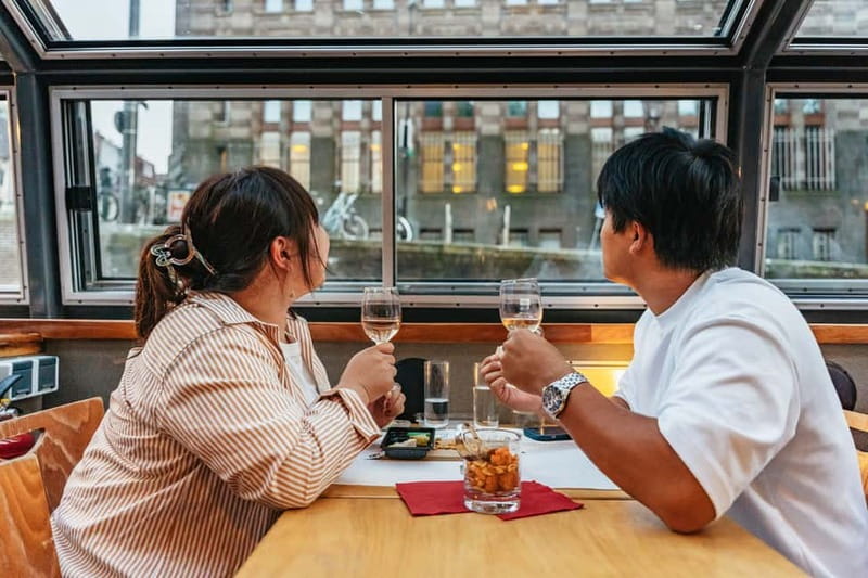 Amsterdam: Cozy Cheese & Wine Cruise Tasting Experience - Dutch cheese, nuts, and drinks