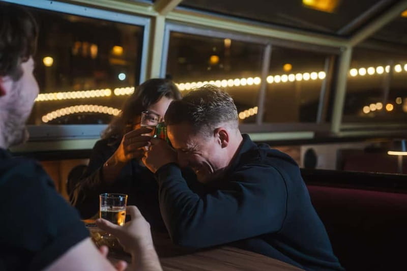Amsterdam: Cozy Cheese & Wine Cruise Tasting Experience - Passing beneath Magere Brug