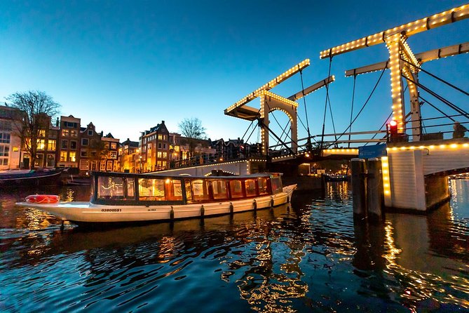 Amsterdam Evening Canal Cruise with Live Guide and Onboard Bar - Boat comfort, weather, and the important booking caveat