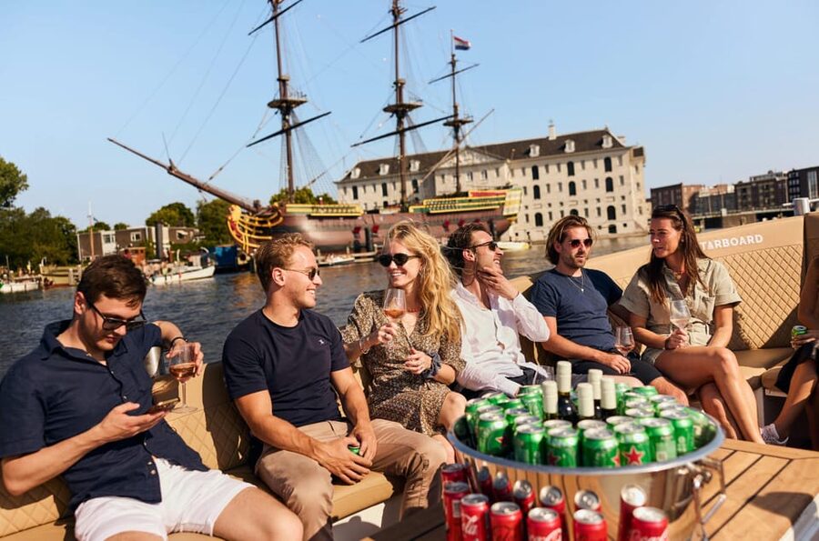 Amsterdam: German Guided Canal Cruise with on Board Bar - Scheepvaartmuseum and Montelbaanstoren