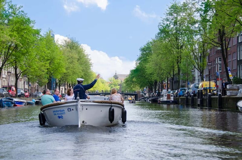 Amsterdam: Guided City Highlights Open Boat Canal Cruise - Why a small open boat changes the Amsterdam canal ride