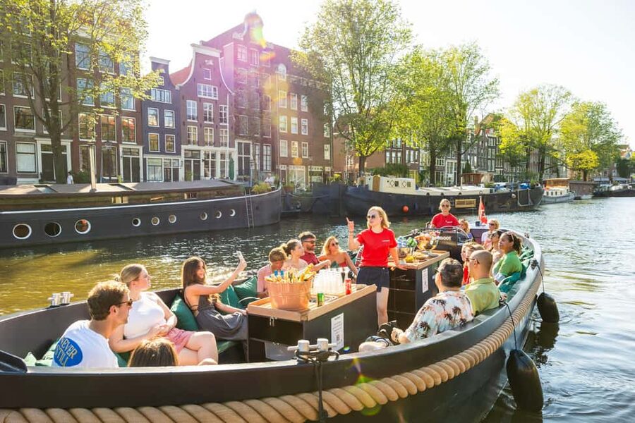 Amsterdam: Guided Open Boat Cruise Unlimited Drinks Option - From Centraal Station to the eastern harbor
