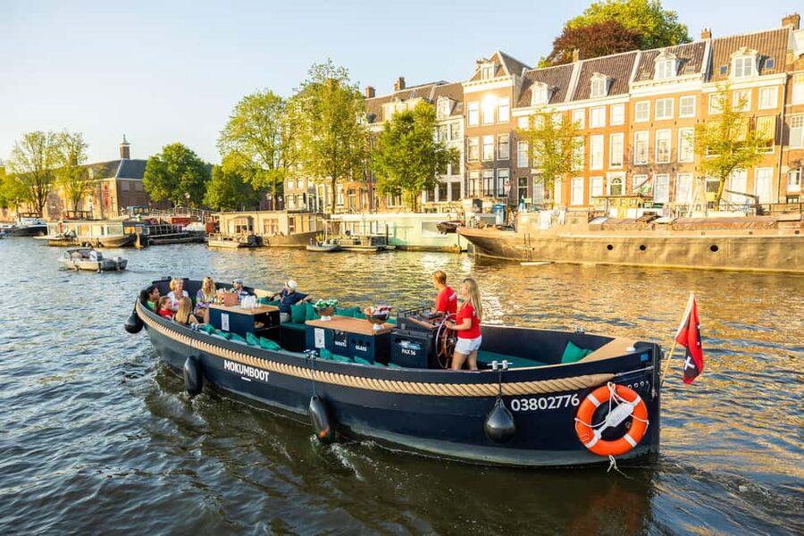 Amsterdam: Guided Open Boat Cruise Unlimited Drinks Option - Old towers, Jewish Amsterdam, and the Amstel