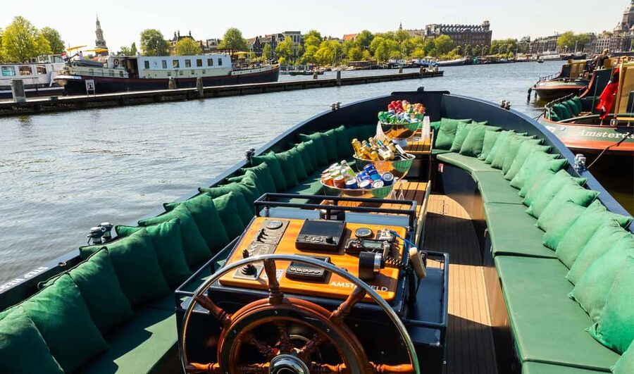 Amsterdam: Guided Open Boat Cruise Unlimited Drinks Option - The Amstel, Magere Brug, and seven bridges