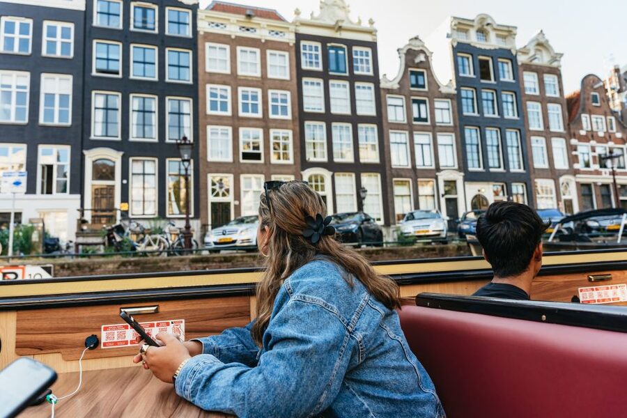 Amsterdam: Heated Canal Cruise Including Audioguide - Warm boats, glass roofs, and rainy-day value
