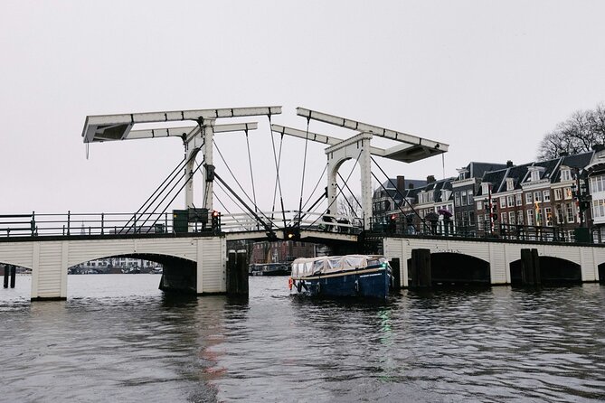 Amsterdam Newest Canal Cruise with local guide and small group - Towers, canals, and the Amstel River