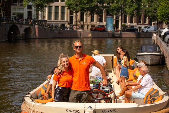 Amsterdam: Saloon Boat Cruise + Unlimited Drinks & Bite option - The Zuiderkerk tower and the city skyline
