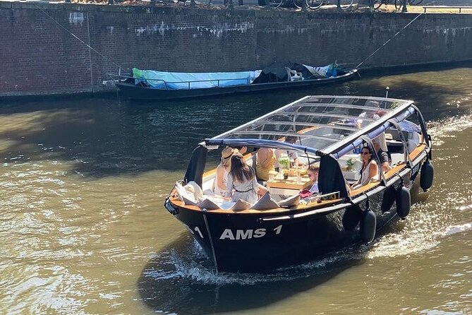 Amsterdam Small-Group Canal Cruise Including Snacks and Drinks - Storehouses, the Maritime Museum, and Hortus Botanicus