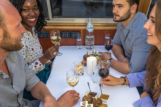 Amsterdam: Wine and Cheese Evening Cruise - Checking in opposite Amsterdam Central Station