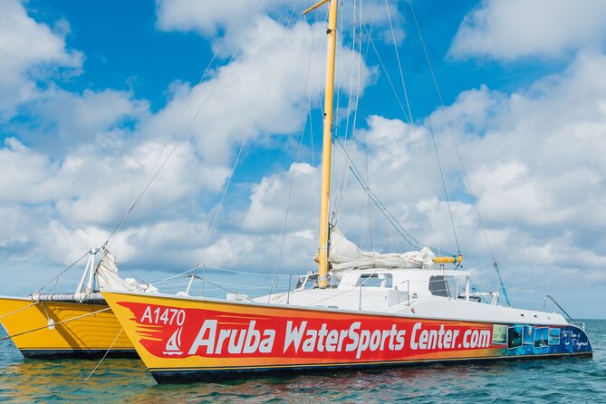 Arusun Catamaran Sail with Snorkeling in Aruba - Boarding from Palm Beach by zodiac