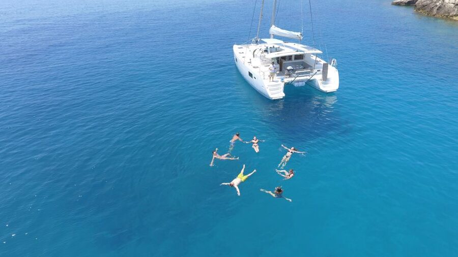 Athens: Riviera Catamaran Cruise with Meal and Drinks - What the crew adds to the day