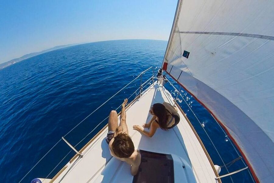 Barcelona: Coastline Boat Trip with Snacks and Cava - Boarding a small boat with a social mood