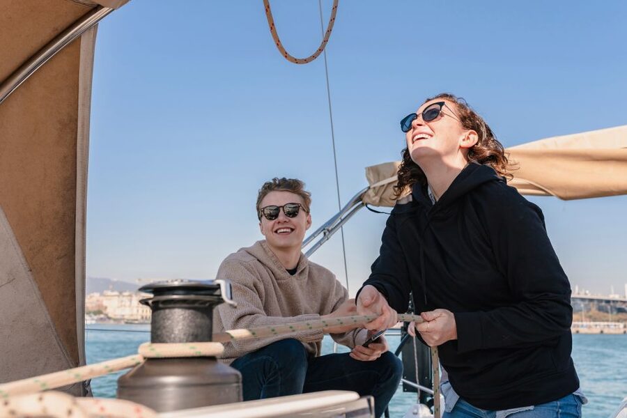 Barcelona: Midday or Sunset Sailing with Open Bar and Snacks - Open bar, light snacks, and the social side