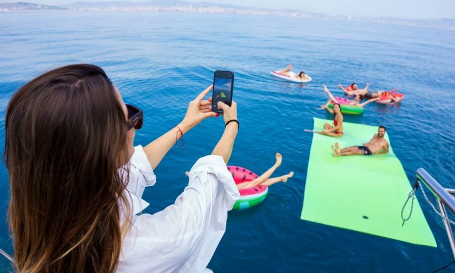 Barcelona: Sunset or Day Catamaran Cruise with Tapa & Drink - Leaving Marina Vela beside Barceloneta