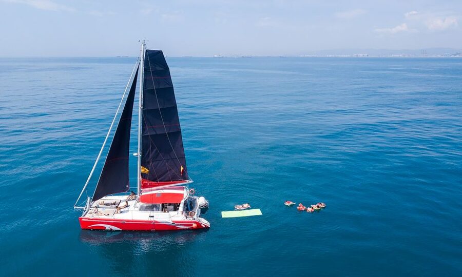 Barcelona: Sunset or Day Catamaran Cruise with Tapa & Drink - The daytime route and 30-minute swim stop