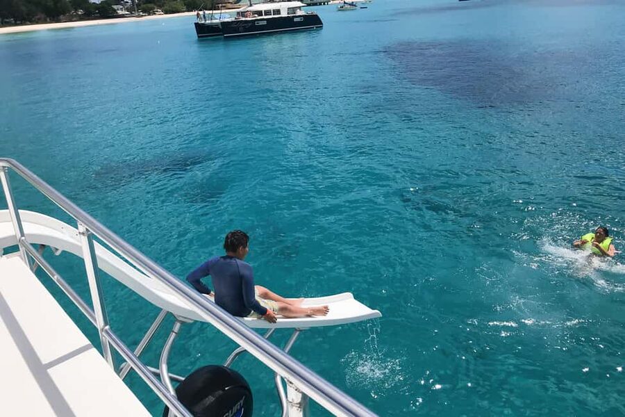 Bridgetown: Carlisle Bay Turtle and Shipwreck Boat Cruise - The boat slide turns the last stop into playtime