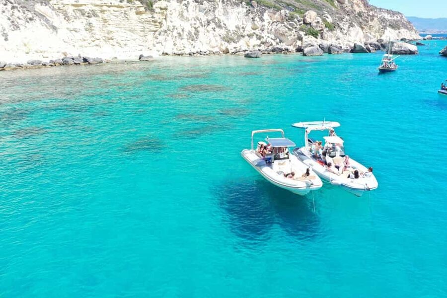 Cagliari: Boat Tour, 4 Stops, Swim, Snorkeling, & 1 Spritz - Leaving Bacan and watching for dolphins