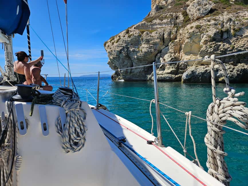 Cagliari Sailing Boat Tour with Snorkeling and Drink - The first swimming stop in natural rock pools