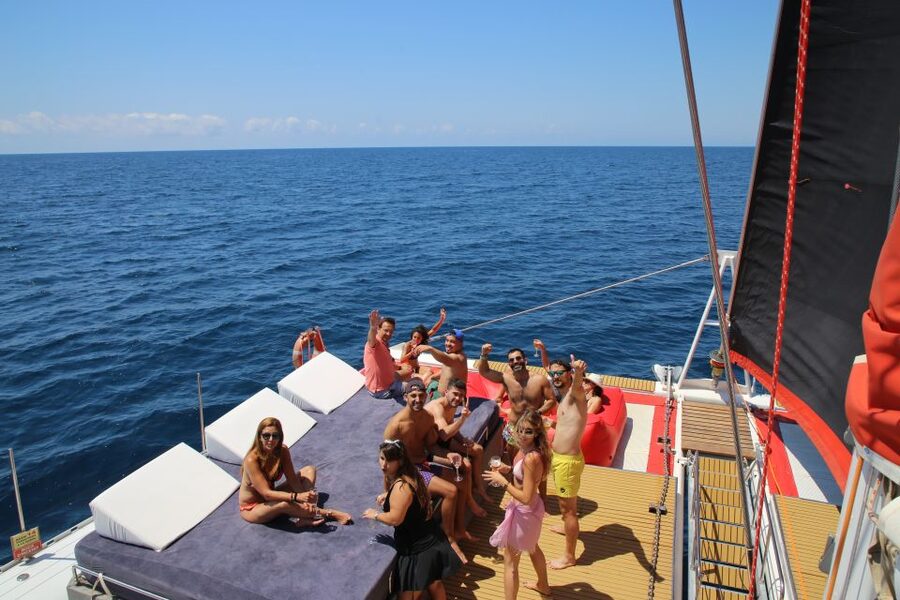 Cambrils: Catamaran Cruise with Drinks and BBQ Lunch Option - A relaxed deck with music and room to move