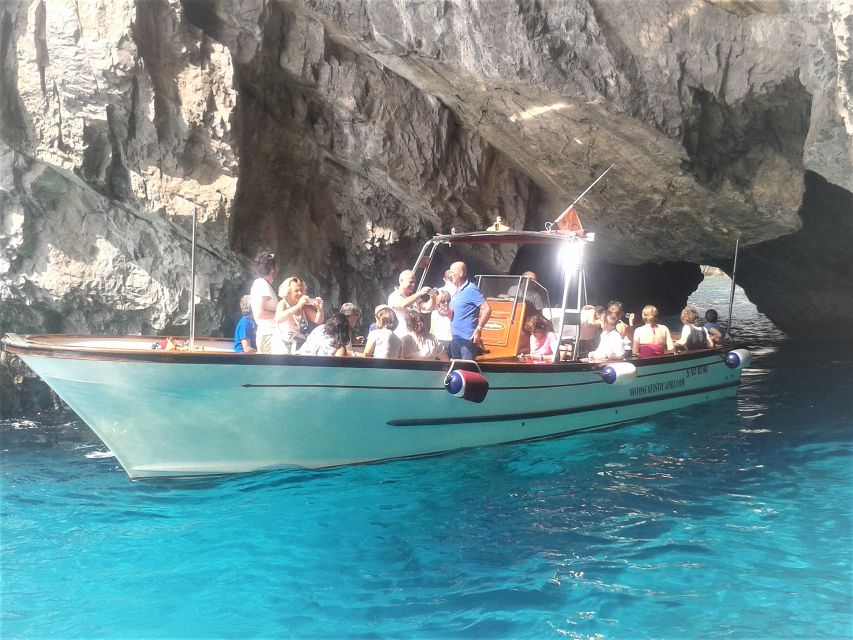 Capri: Island Boat Tour with Blue Grotto Stop - Passing through the Faraglioni Rocks