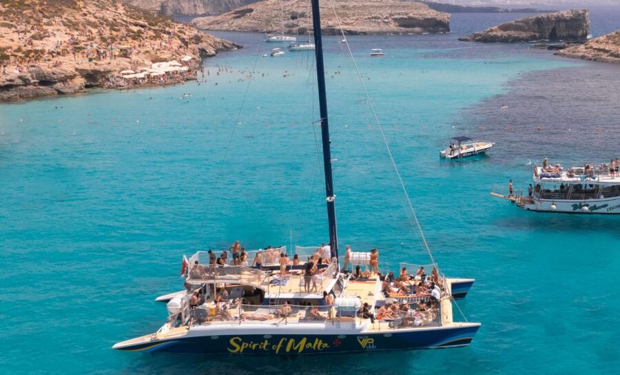 Comino: Blue Lagoon Catamaran Cruise with Lunch and Open Bar - From calm sailing to dancing at sea
