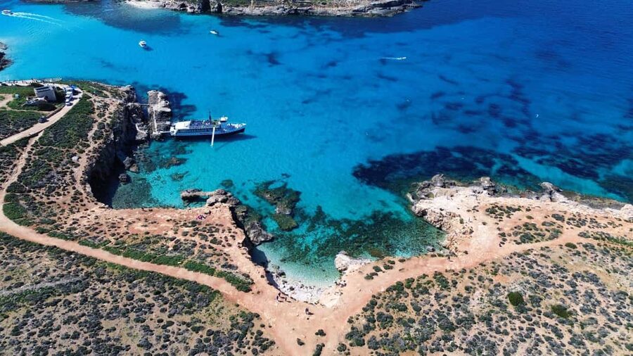 Comino: Blue Lagoon & Caves Boat Cruise - The slide, jump points, and deck life