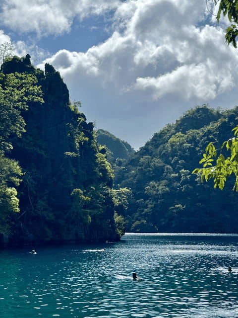 Coron: Private Boat Hire with Guided Tour and Lunch on Beach - Twin Lagoon and the caves