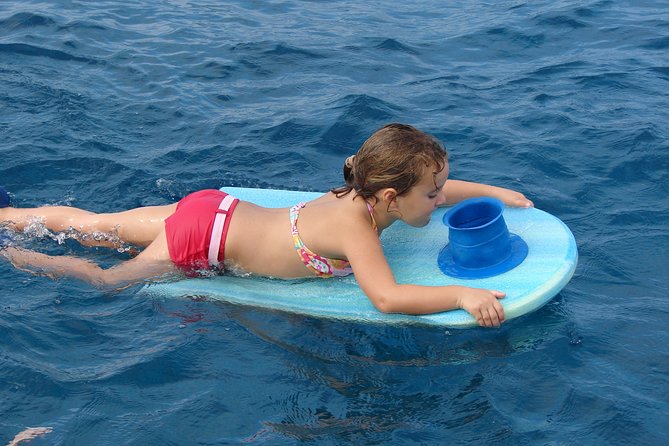 Deluxe Snorkel & Dolphin Watch Aboard a Luxury Catamaran from Kailua-Kona - Who will get the most from the $183.77 price