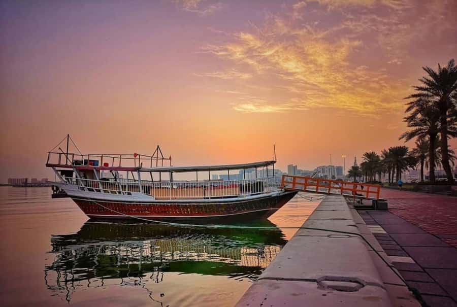 Doha: Sunset Serenade Skyline Dhow Cruise with Buffet Dinner - The Corniche, Dhow Harbor, and West Bay views