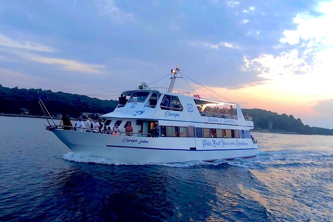 Dolphin Watching & Sunset Boat Tour With Dinner and Drinks - Returning to Pula after sunset