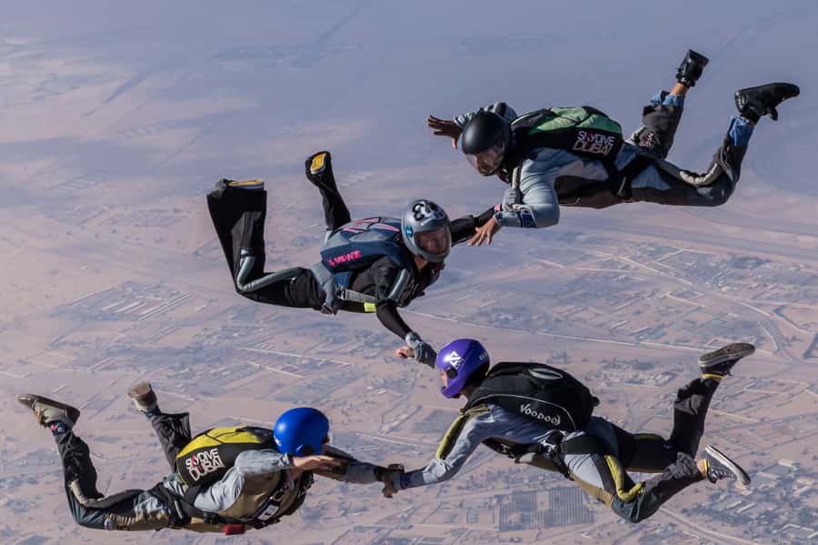 Dubai: Skydive at The Palm with Photos, Video & Yacht Tour - The 20-minute climb to 13,000 feet