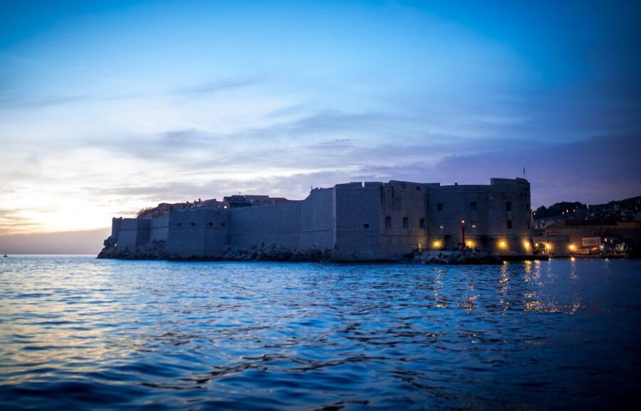 Dubrovnik: Panoramic Sunset Cocktail Cruise Around Old Town - Sailing past the City Walls