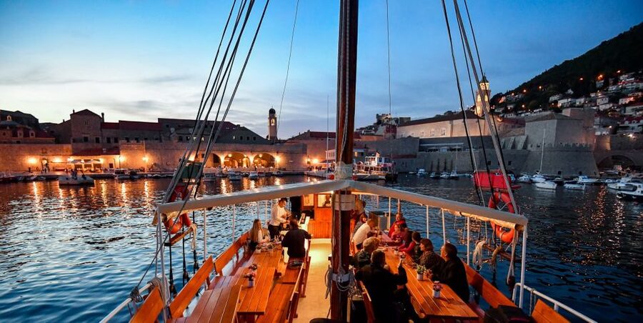 Dubrovnik: Panoramic Sunset Cocktail Cruise Around Old Town - Finding Slavija in Dubrovnik’s Old Port