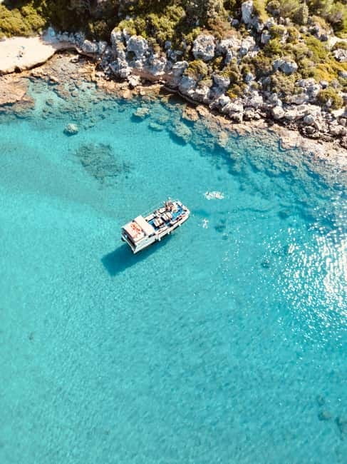 Faliraki: Boat Trip to Anthony Quinn & The Caves with Drinks - Traganou Caves: a short swim into the rocks