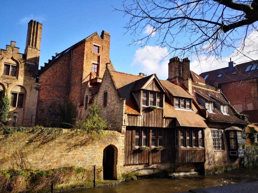 From Amsterdam: Bruges Day Trip in Spanish with Boat Option - Grote Markt, Belfort, and the end of the guided walk