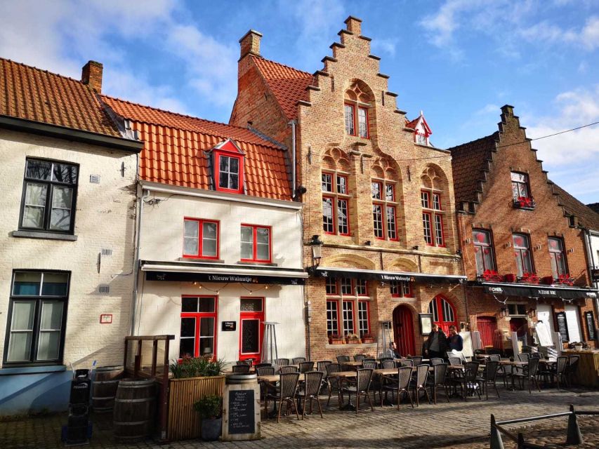 From Amsterdam: Bruges Day Trip in Spanish with Boat Option - Meeting the bus near Aloha Bowling