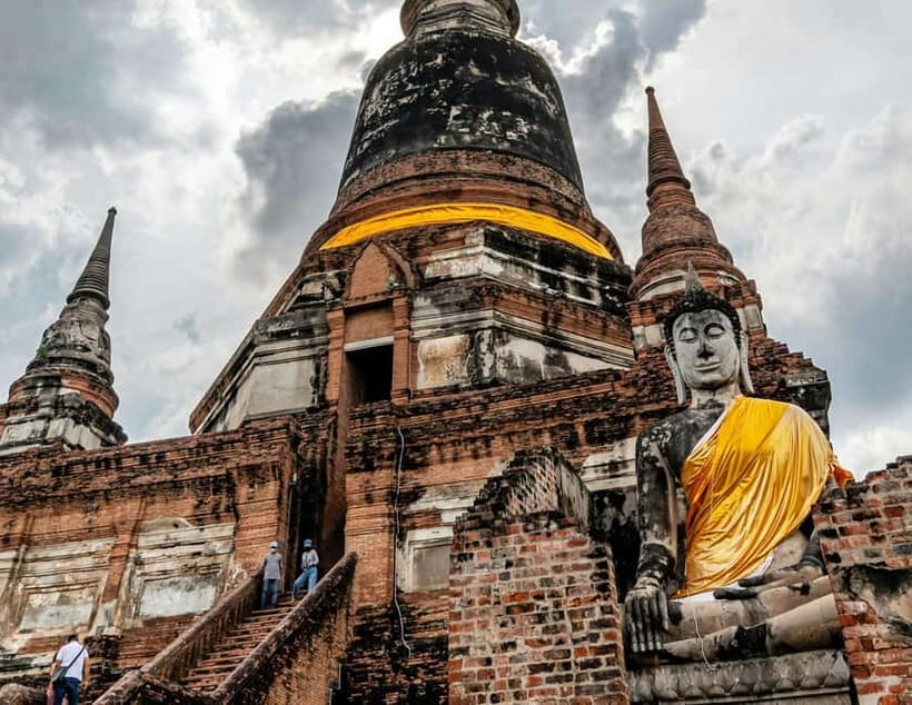 From Bangkok: Ayutthaya Heritage Tour with Sunset Boat Ride - Wat Maha That and the Buddha in the tree roots