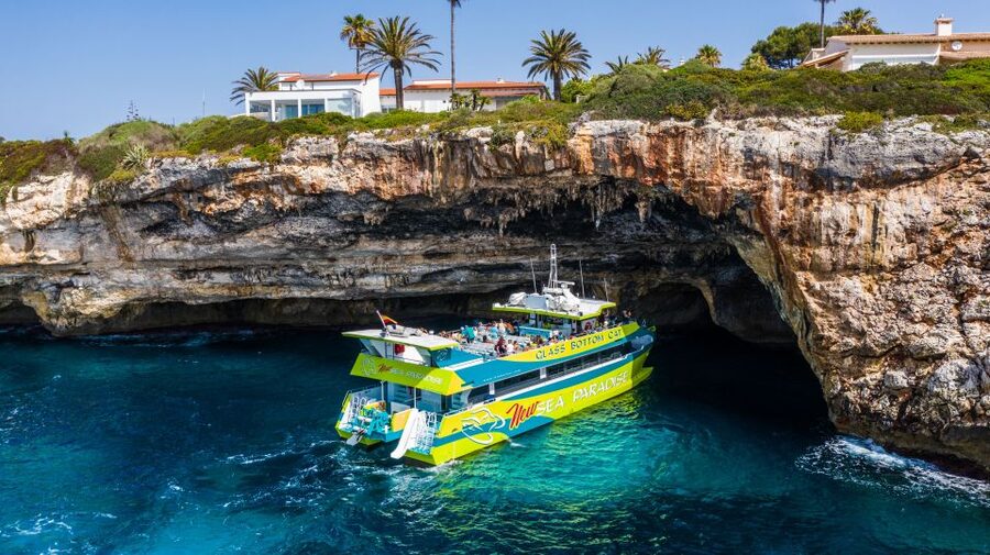 From Cala Millor: East Coast Glass-Bottom Boat Trip - The four-hour Calas de Mallorca trip with two swim stops
