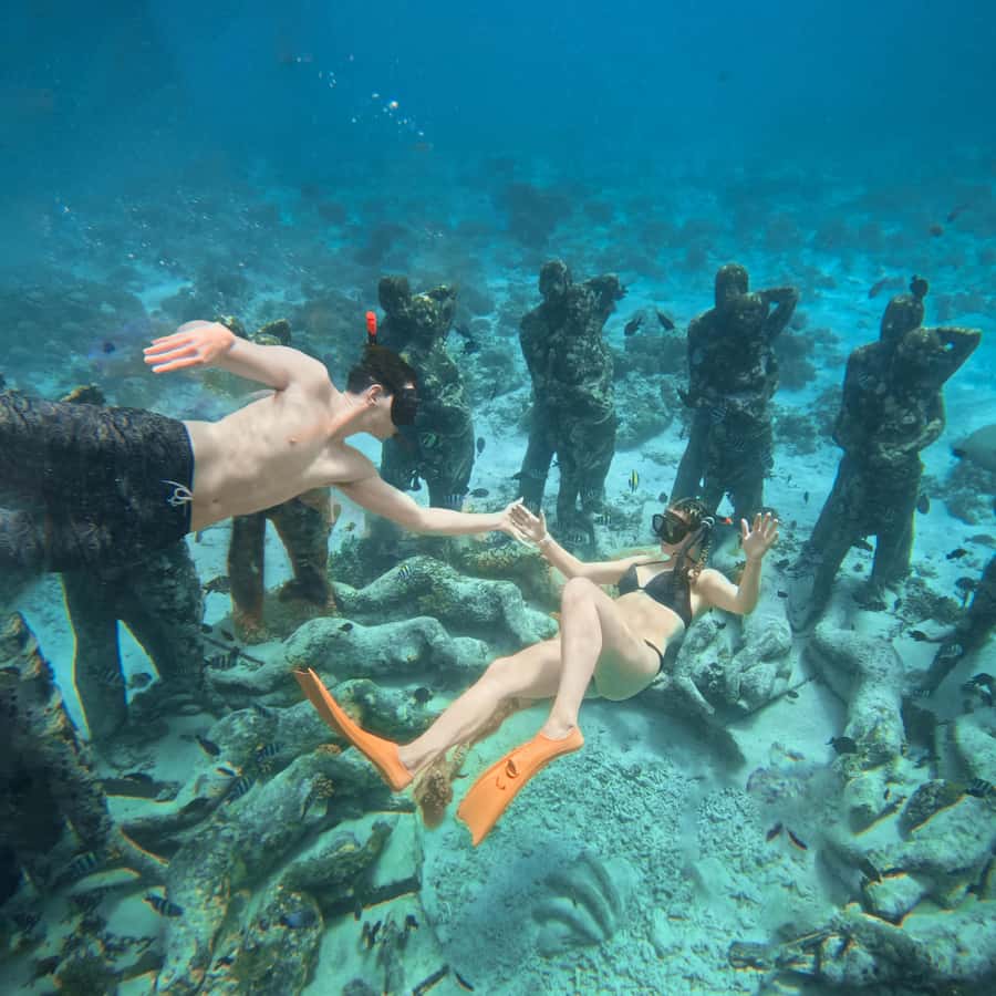 From Gili Trawangan: Gili Islands Snorkeling Boat Tour - The Nest statues and the reality of crowds