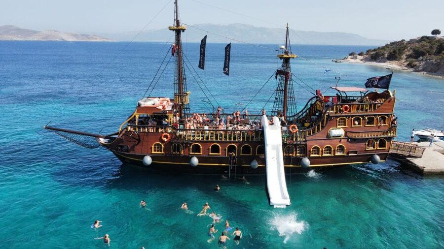 From Kos: 3-Island Pirate Cruise with Lunch and Waterslide - The crew, music, and onboard rhythm