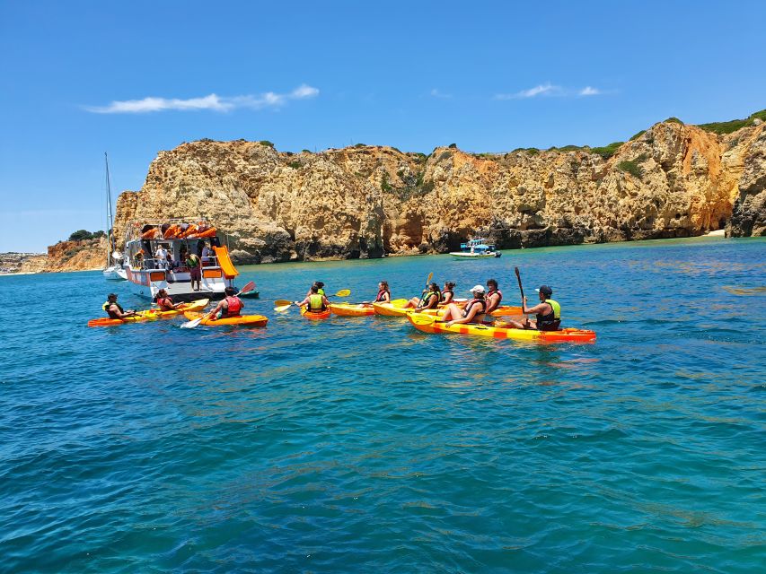 From Lagos: Ponta da Piedade Caves Kayak Tour from Catamaran - Returning to the catamaran for a swim