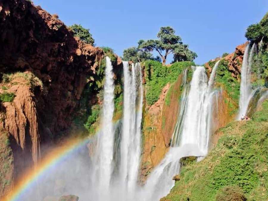 From Marrakech: Ouzoud Waterfalls Guided Trip with Boat Ride - Arriving among red cliffs and olive trees