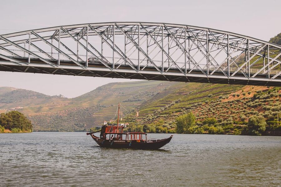 From Pinhão: Douro Valley Rabelo Boat Tour with Port Wine - Leaving Pinhão beneath the Eiffel Bridge