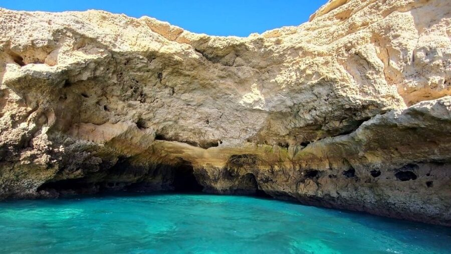 From Portimão: Algar de Benagil and Sea Caves Boat Tour - The return ride shows the Algarve from farther out