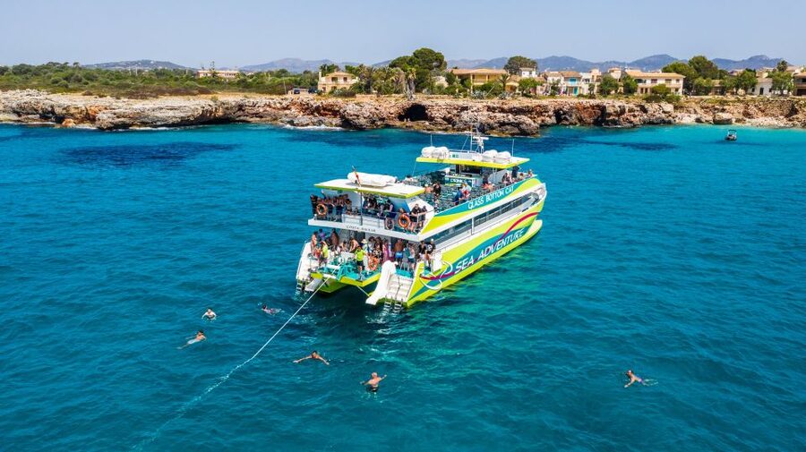 From Porto Cristo: East Coast Glass-Bottom Boat Trip - The swimming stop is the real highlight